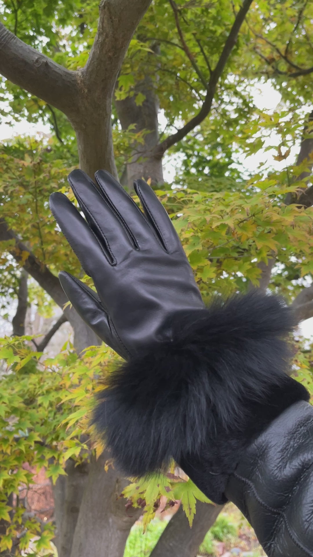 Black leather gloves with fur outlet trim